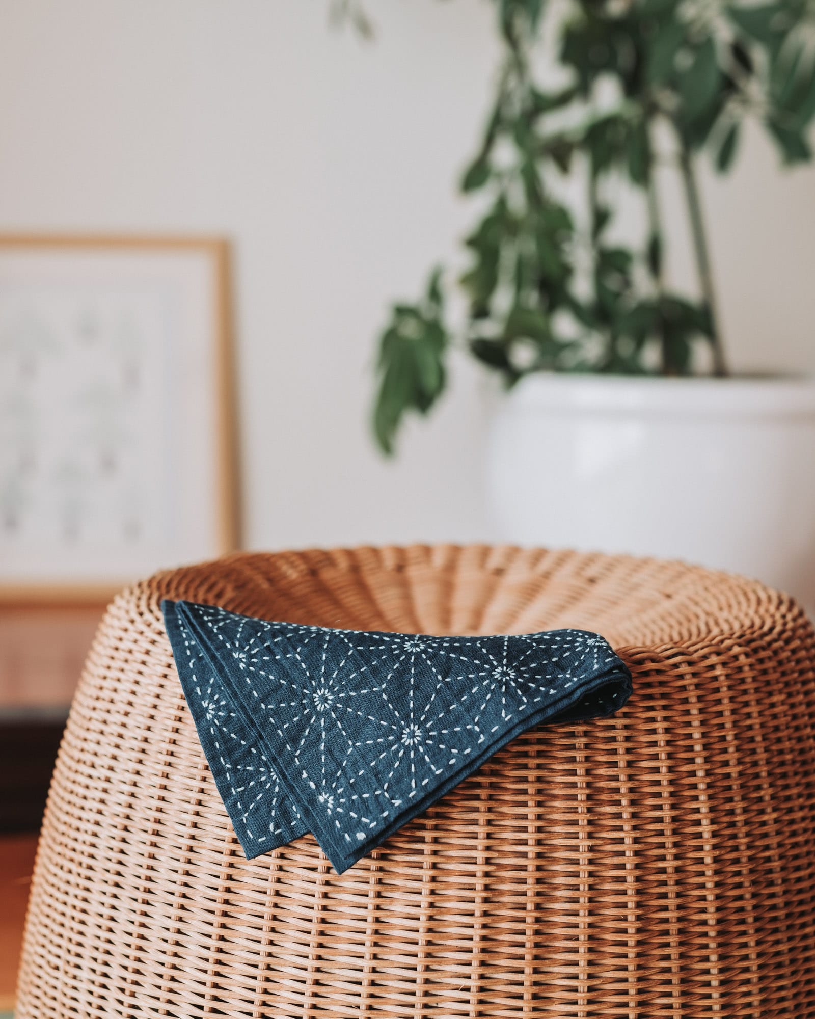 Asanoha pattern on a kitchen cloth draped across a rattan stool.