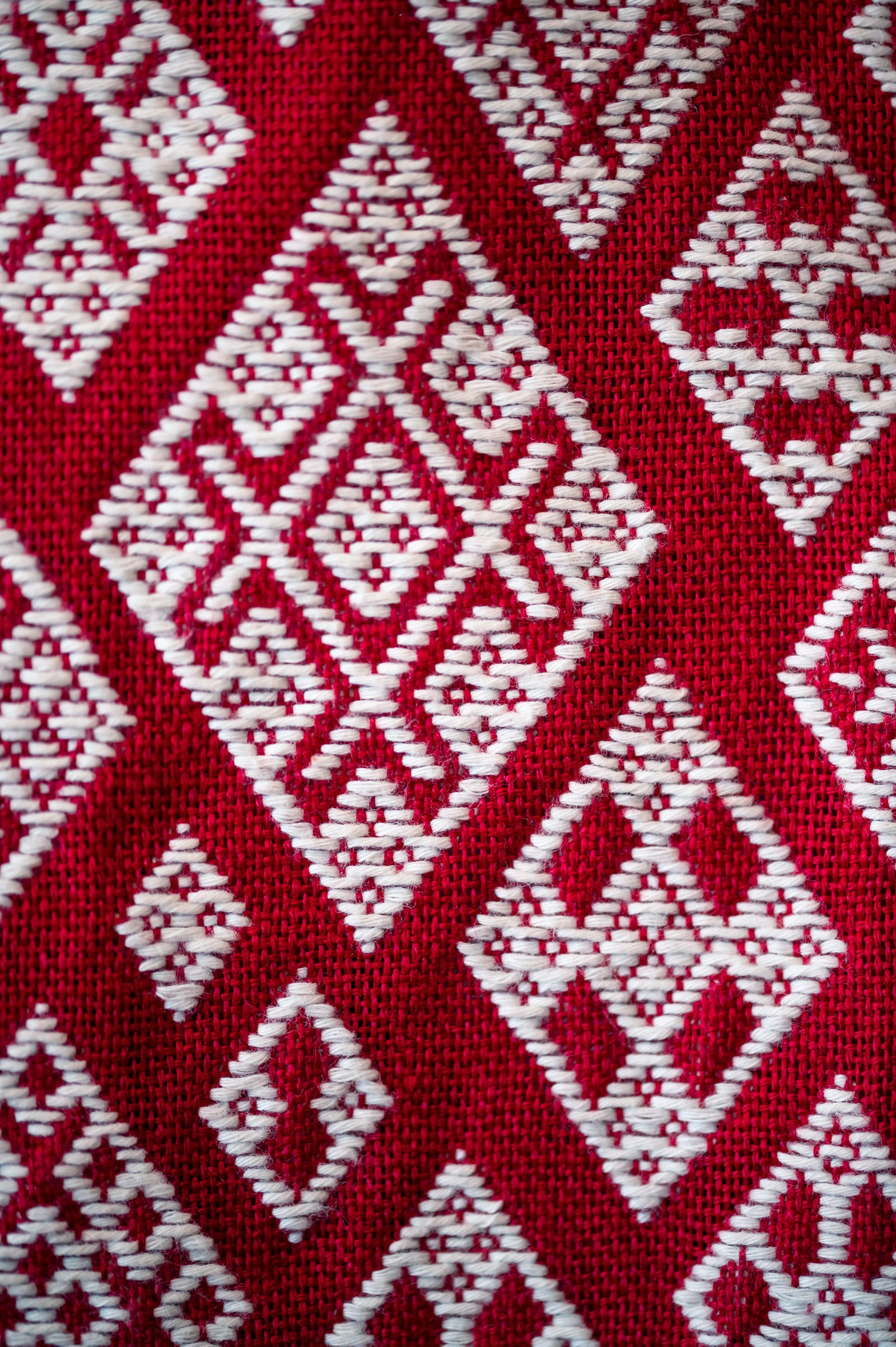 Red cloth embellished with white kogin thread.