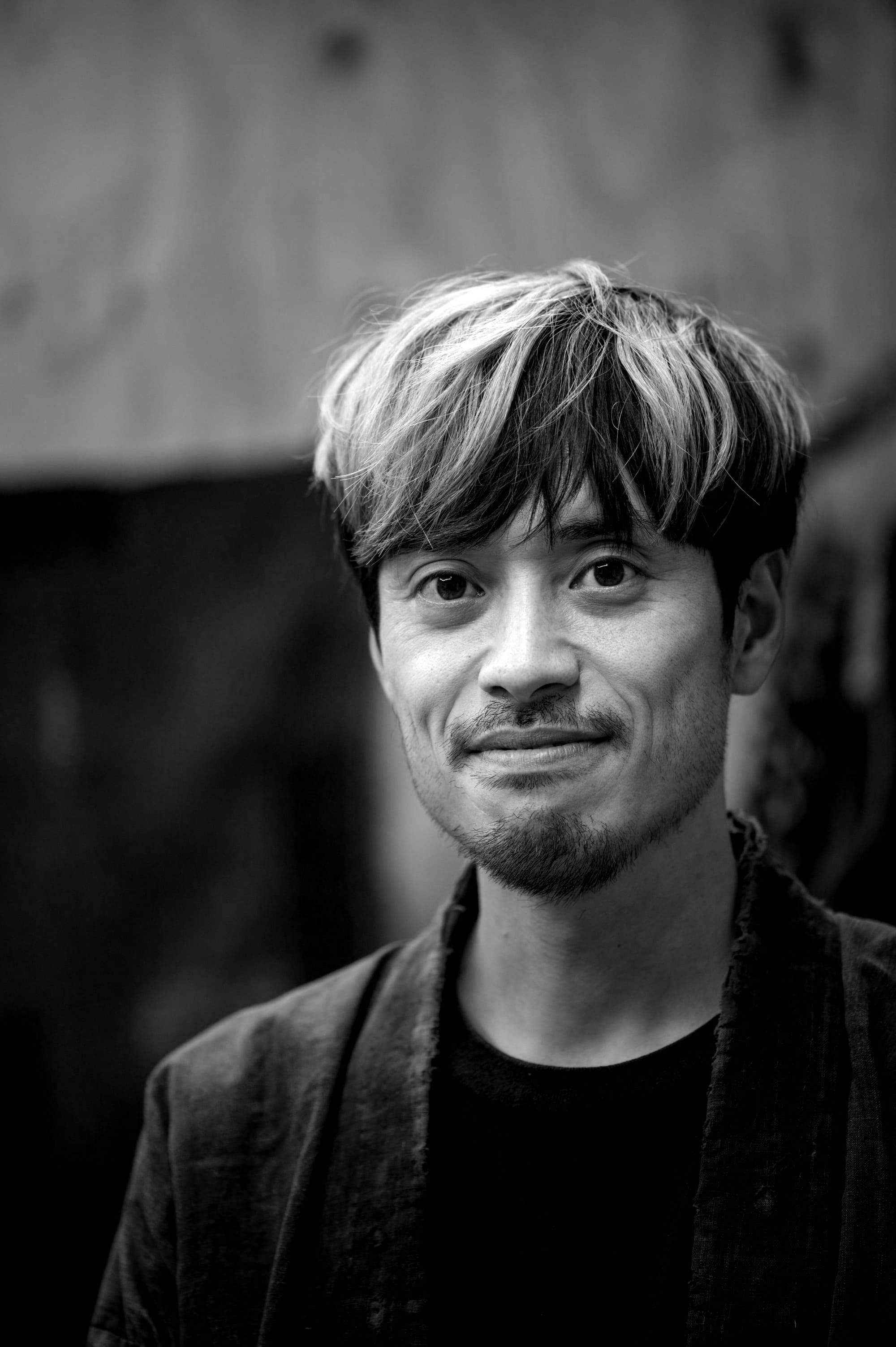 Portrait of JunAle wearing a blue haori over a black t-shirt